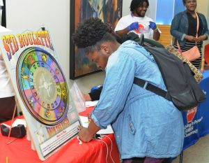 ASU students visited community partner tables at the Project Prevent Block Party to learn more about HIV awareness and prevention resources.