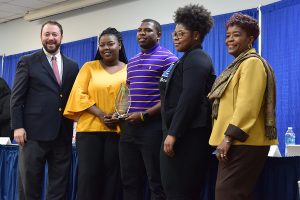 Albany State University Greek organization members accept the Keep Albany-Dougherty Beautiful service award on behalf of the ASU National Pan-Hellenic Council (NPHC). L to r: Commission Chairman, Chris Cohilas; Keyonna Jackson (Sigma Gamma Rho Sorority Inc.); Bobby Andrews (Omega Psi Phi Fraternity Inc.); Taylor Turner (Zeta Phi Beta Sorority Inc.) and Mayor Dorothy Hubbard.