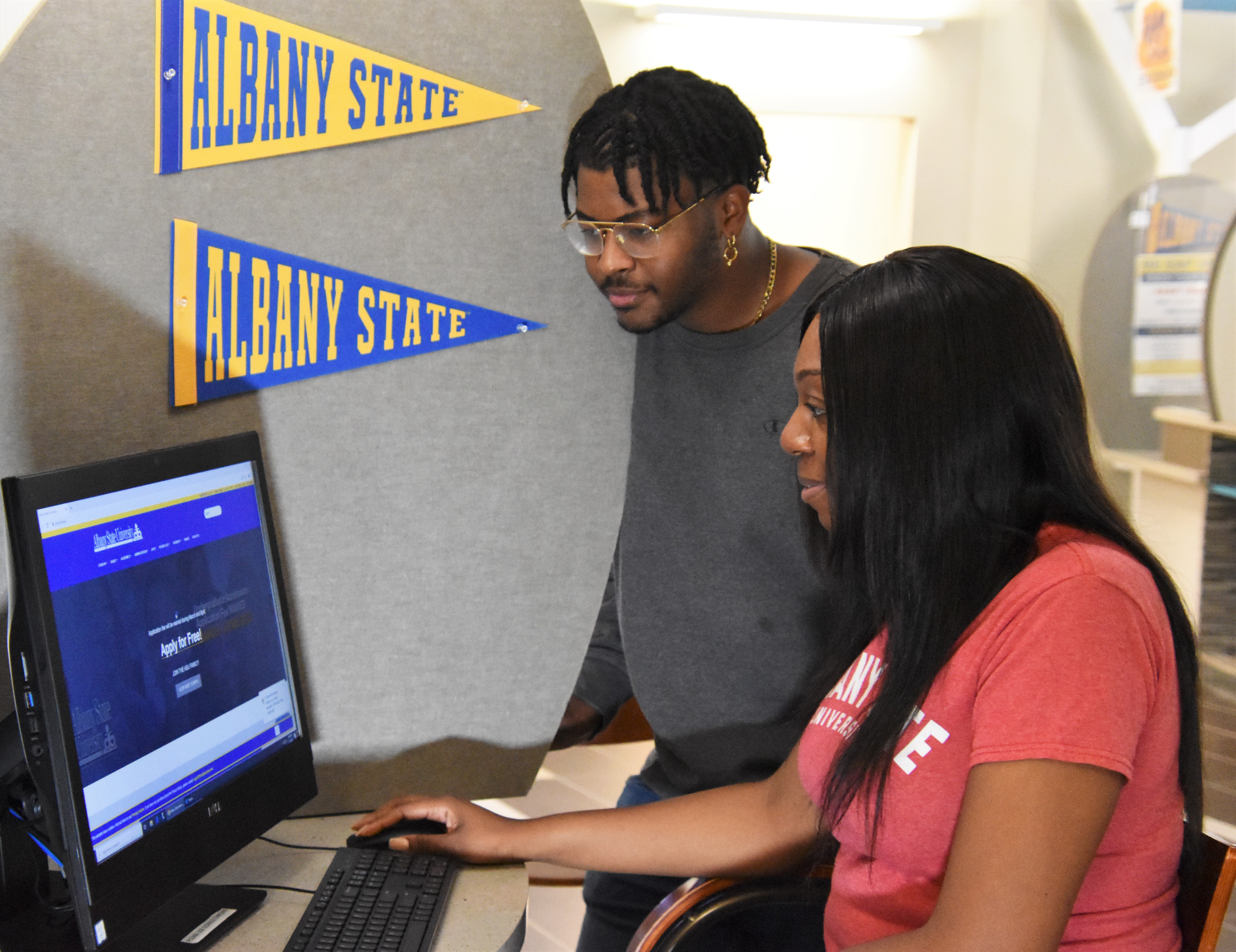 Male and Female student at computer